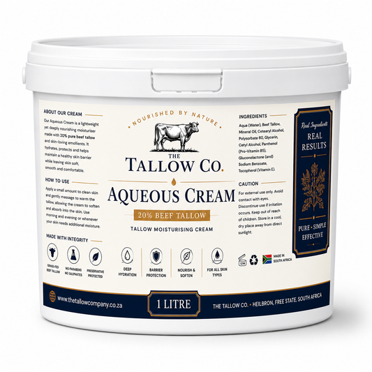 A 1 litre white plastic tub of The Tallow Co. Aqueous Cream 20% Beef Tallow moisturising cream, featuring a detailed cream-colored label with black and gold text and a cow logo.