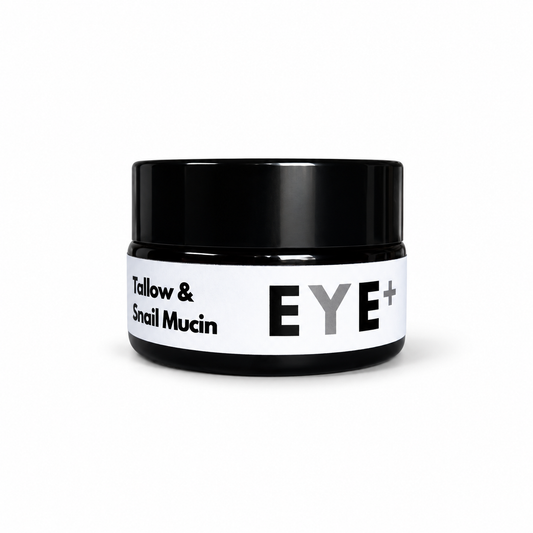 The Tallow Co. black cosmetic jar with a white label reading 'Tallow & Snail Mucin' and 'EYE+' in bold black and gray lettering, set against a plain white background.